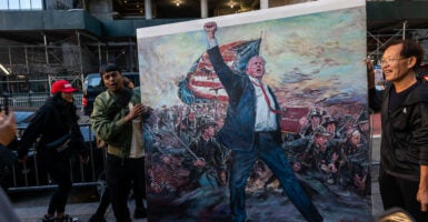 Voters unveil painting of Trump in New York City.