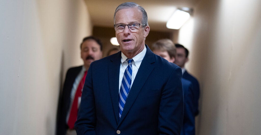 Leader John Thune stand in the capitol.