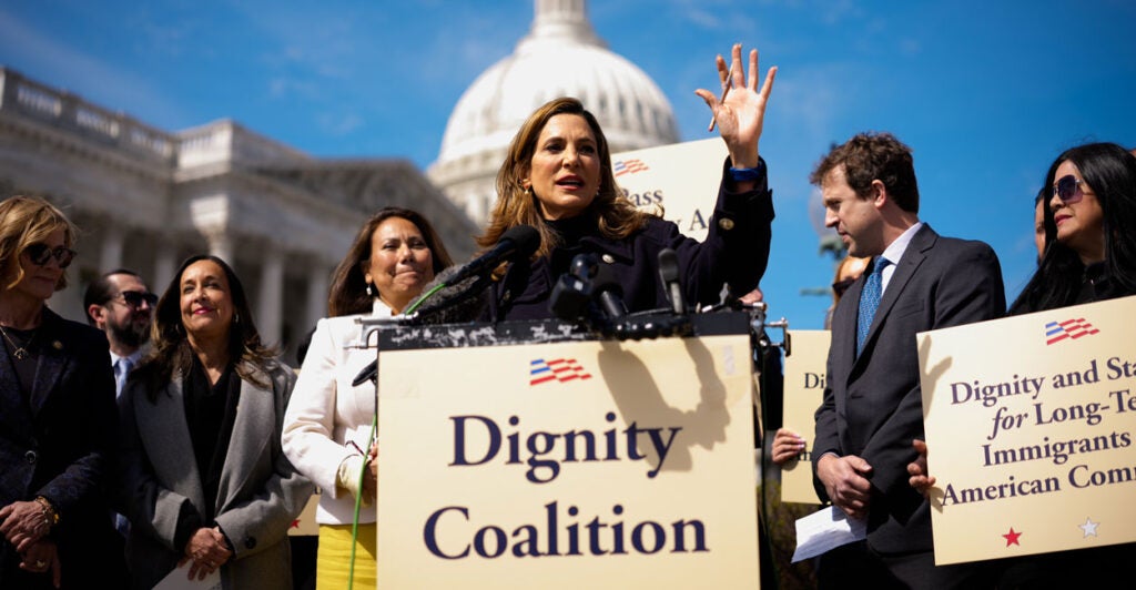 Rep. Maria Elvira Salazar (R-FL) (C), accompanied by Rep. Veronica Escobar (D-TX) (C-L), speaks at a Dignity Coalition news conference on Capitol Hill.