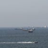 Ships and tankers in the Strait of Hormuz off the coast of Musandam, Oman.