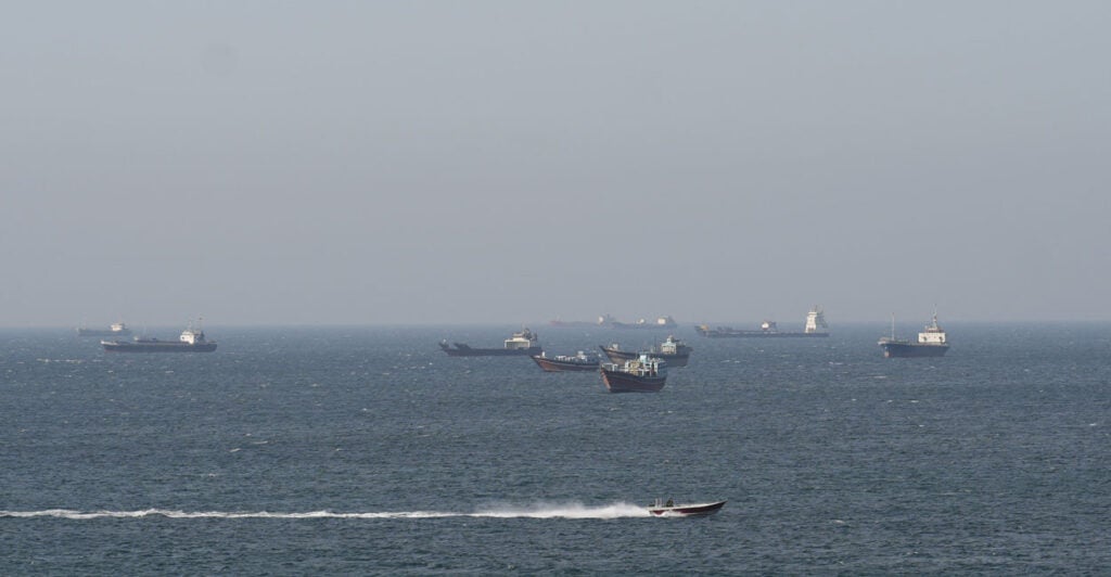 Ships and tankers in the Strait of Hormuz off the coast of Musandam, Oman.