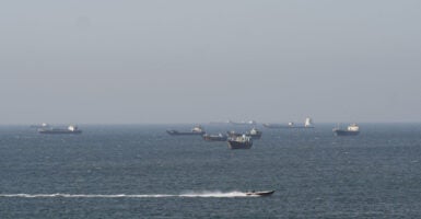 Ships and tankers in the Strait of Hormuz off the coast of Musandam, Oman.