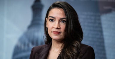 Alexandria Ocasio Cortez speaks to reporters at the United States capitol.