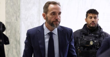 WASHINGTON, DC - DECEMBER 17: Former Special Counsel Jack Smith (C) arrives to testify during a closed-door deposition before the House Judiciary Committee in the Rayburn House Office Building on Capitol Hill on December 17, 2025 in Washington, DC. Smith was appointed independent special counsel by Attorney General Merrick Garland in 2022 to oversee two criminal investigations into former President Donald Trump's role in the January 6, 2021 attack on the U.S. Capitol and mishandling of classified documents. Both cases were eventually dismissed and Trump went on to win his second presidential election in 2024. (Photo by Alex Wong/Getty Images)