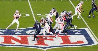 SANTA CLARA, CALIFORNIA - FEBRUARY 08: Drake Maye #10 of the New England Patriots drops back to pass against the Seattle Seahawks during the fourth quarter in Super Bowl LX at Levi's Stadium on February 08, 2026 in Santa Clara, California. (Photo by Thearon W. Henderson/Getty Images)