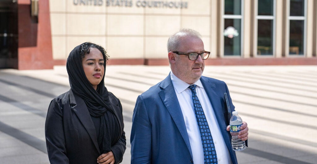 Ladan Ali, accused of giving a bribe of $120,000 in cash to a juror in the Feeding Our Future trial, and her attorney.