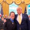 Donald Trump and Arthur Laffer smiling
