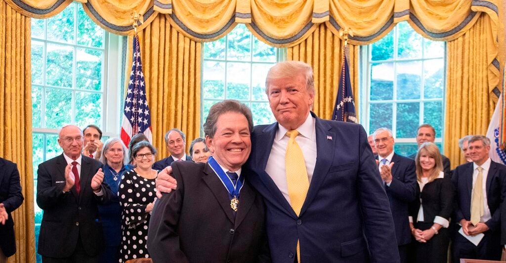 Donald Trump and Arthur Laffer smiling