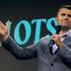 Charlie Kirk speaking with a microphone