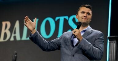 Charlie Kirk speaking with a microphone