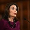 N.Y. Gov. Kathy Hochul speaking at a microphone