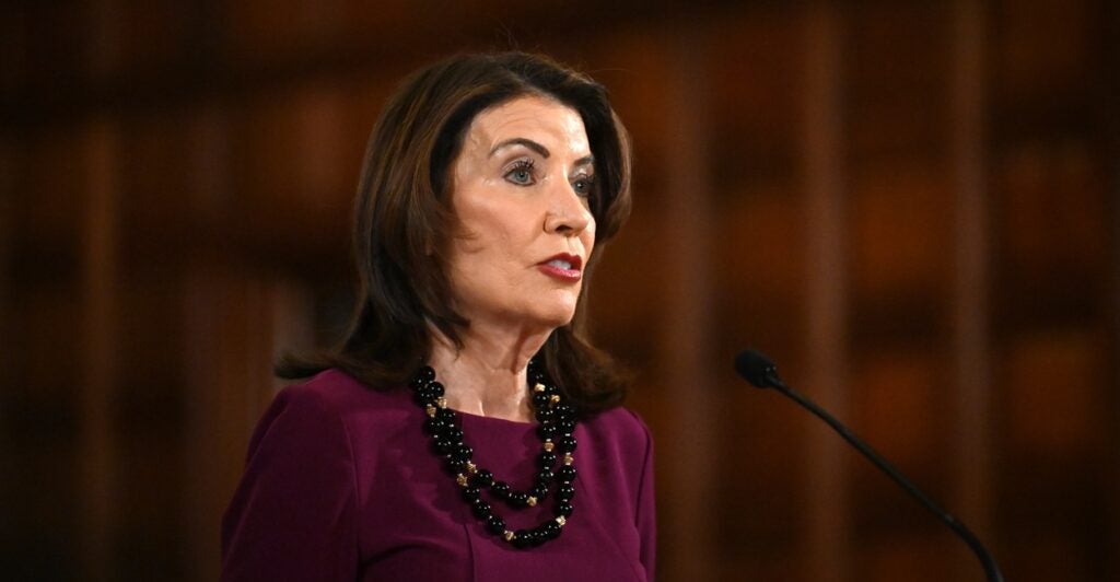 N.Y. Gov. Kathy Hochul speaking at a microphone