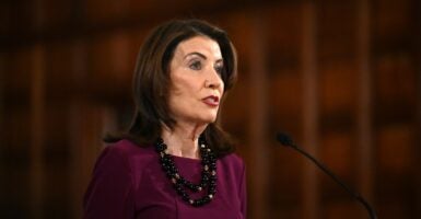 N.Y. Gov. Kathy Hochul speaking at a microphone