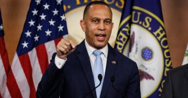 Hakeem Jeffries speaking at a podium