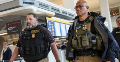 ICE agents in an airport