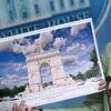 Karoline Leavitt shows an artist's rendering of the planned Triumphal Arch