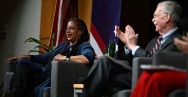 John Bolton and Susan Rice seated