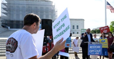 WASHINGTON, DC - APRIL 22: Wael Elkoshairi, right, a parent in the Montgomery County MD speaks to restore the Opt-Out policy in public schools at a rally as oral arguments on Mahmoud v. Taylor, a religious freedom case involving LBGTQ+ curriculum. A diverse coalition of plaintiffs seek to defend their rights as religious parents to be notified and opt their children out of Montgomery County Maryland's controversial LGBTQ curriculum at the Supreme Court in Washington, DC on April 22, 2025. (Photo by John McDonnell/For The Washington Post via Getty Images)