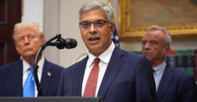 WASHINGTON, DC - SEPTEMBER 22: U.S. Director of the National Institutes of Health Jay Bhattacharya, joined by President Donald Trump (L) and Health and Human Services Secretary Robert F. Kennedy Jr., delivers remarks during an announcement by President Donald Trump on “significant medical and scientific findings for America’s children” in the Roosevelt Room of the White House on September 22, 2025 in Washington, DC. Federal health officials suggested a link between the use of acetaminophen during pregnancy as a risk for autism, although many health agencies have noted inconclusive results in the research. (Photo by Andrew Harnik/Getty Images)
