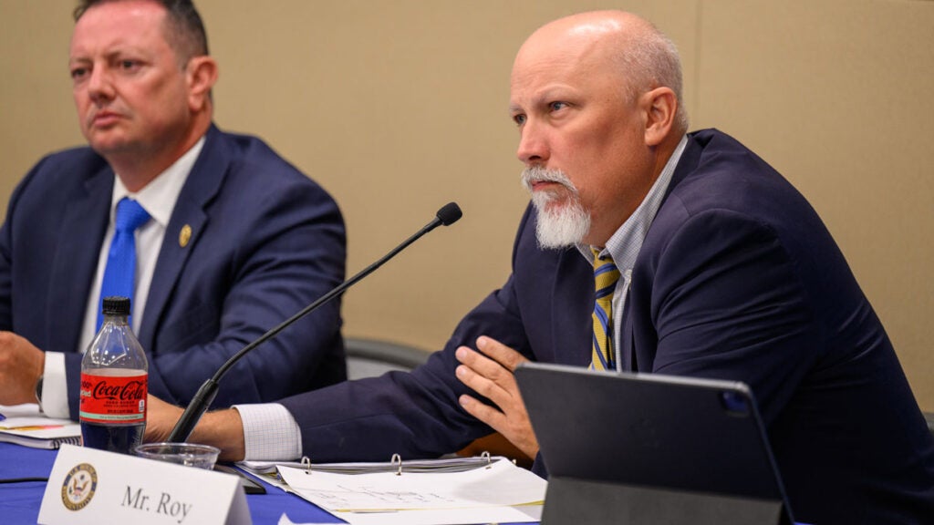 Chip Roy waits to speak at a committee roundtable.