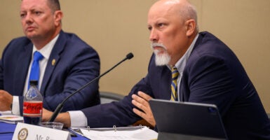 Chip Roy waits to speak at a committee roundtable.